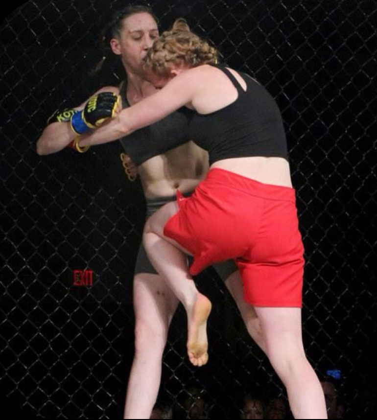 Moriel, an MMA fighter, delivers a kick to her opponent
